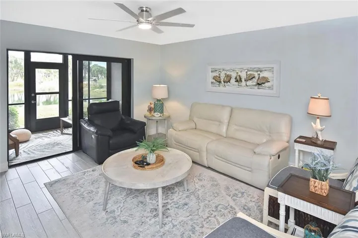 Indoor living room area...notice the tile floors which are throughout...neutral and consistent.