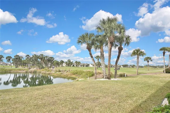Step out of the screened lanai to the lake and golf course.
