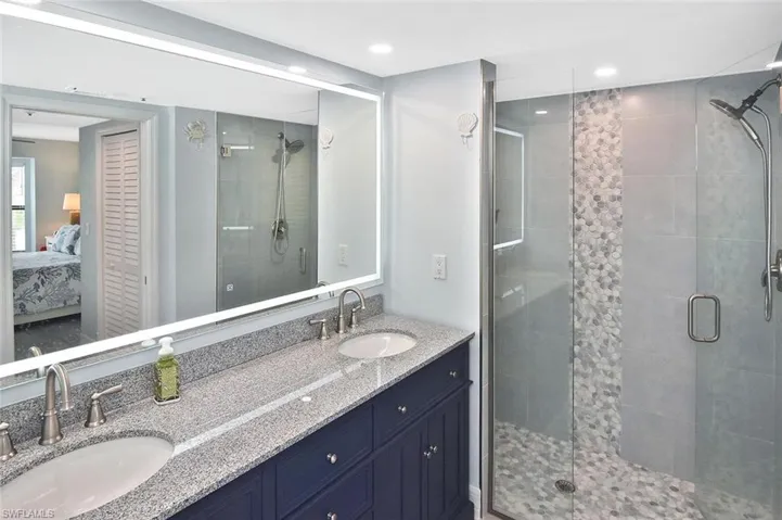 Double sinks and an amazing step-in shower.