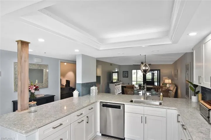 Thoughtful design has opened the kitchen area and includes bar-style seating.