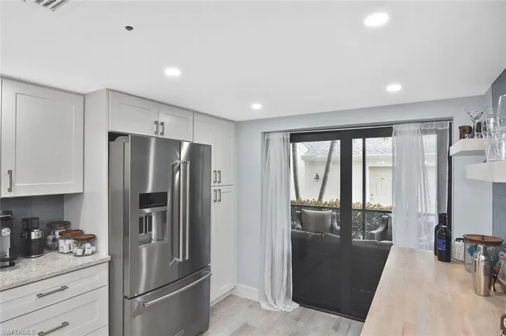 Impact sliders from the kitchen to the front enclosed lanai.