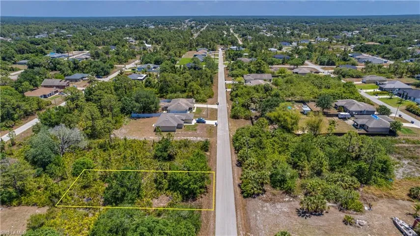 Aerial view of residential area with property parcel outlined