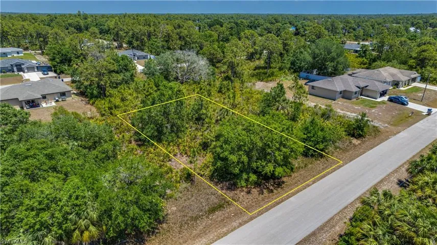 View of property location with property boundaries highlighted and a heavily wooded area