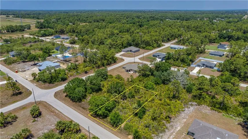 Aerial overview of property's location featuring property boundaries highlighted