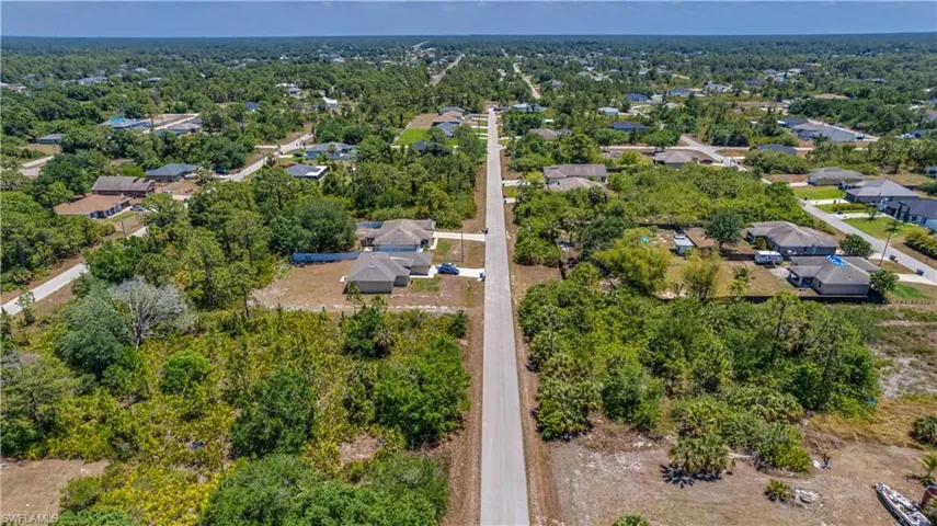 Aerial overview of property's location with nearby suburban area