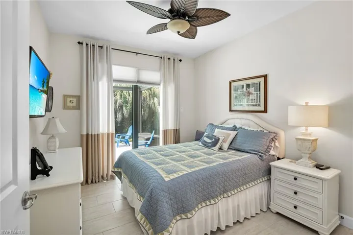 Bedroom with access to exterior and ceiling fan