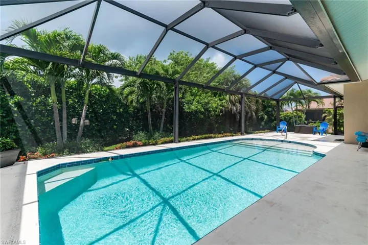 Outdoor pool featuring a patio area and a lanai
