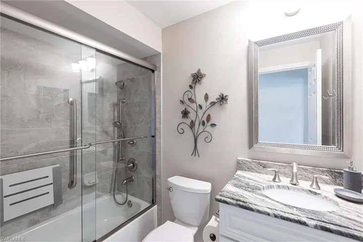 Guest Bath ~ Just Outside the Guest Room   Newer Counters, Cabinets, Mirrors, Lighting and Shower Tile /Glass Doors