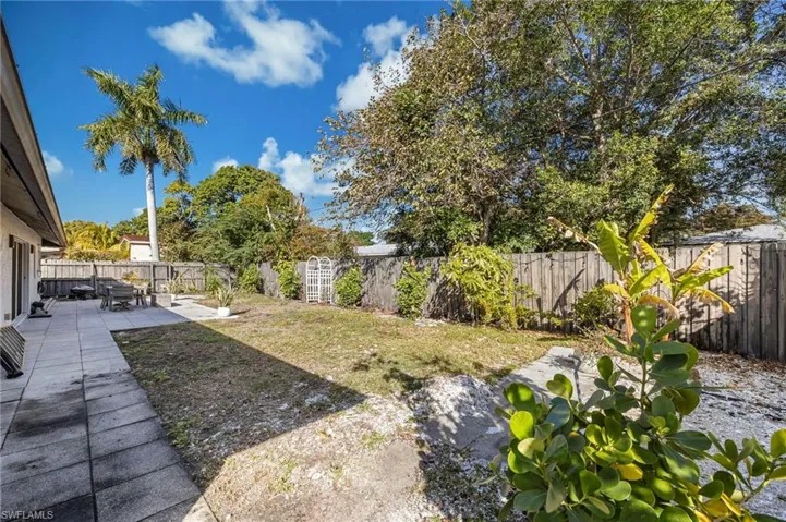 Fenced backyard featuring a patio area