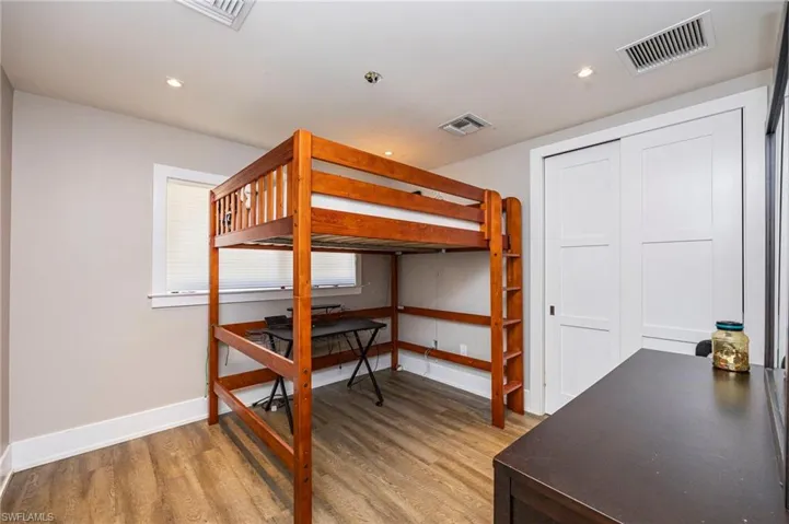 Bedroom featuring light wood-type flooring and recessed lighting