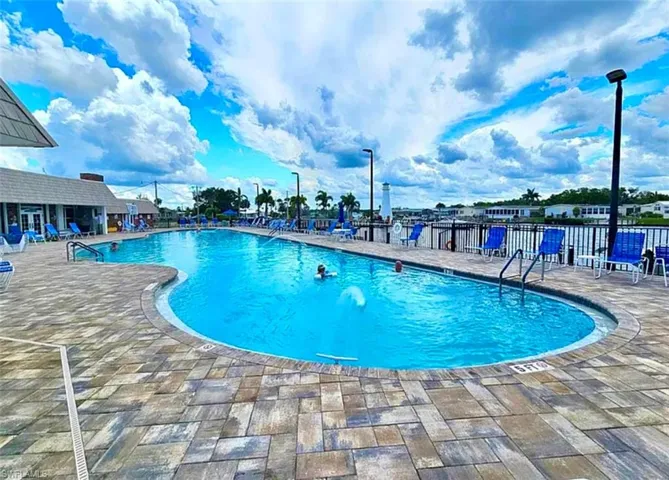 Community pool with a patio area