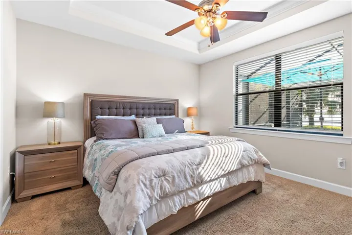 Owner's Bedroom with Tray Ceiling & Window w/View of Lake