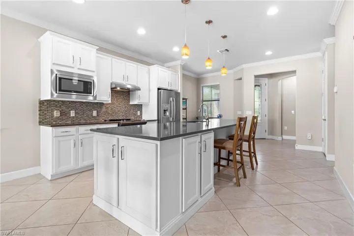 Kitchen featuring a Quartz Island & Pendant Lights