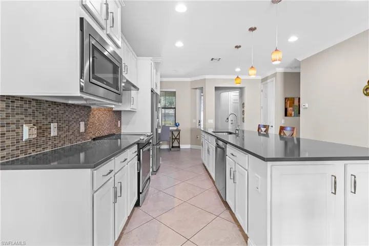 Kitchen featuring White Shaker Cabinets & Stainless Appliances