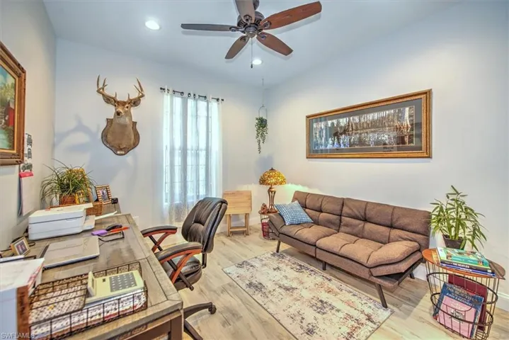 Office featuring ceiling fan and light wood-type flooring