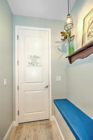 Doorway to outside with light wood-type flooring