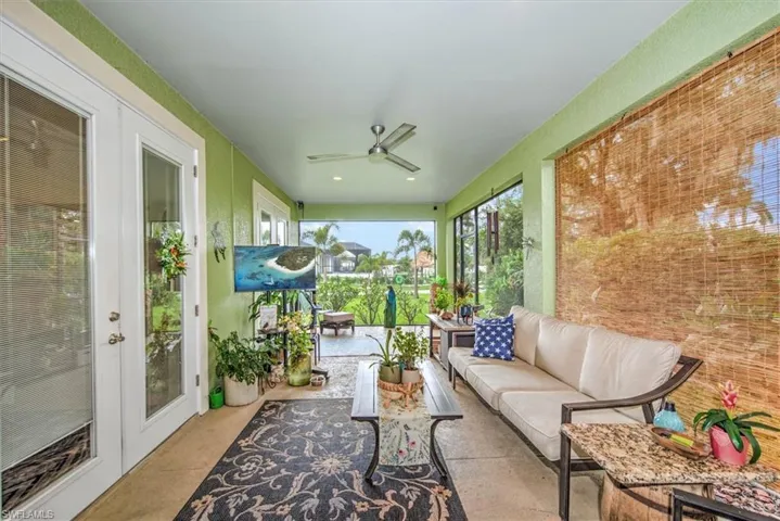 Sunroom with ceiling fan and french doors