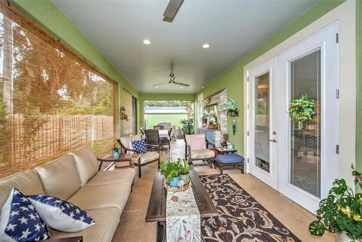 Sunroom with french doors and ceiling fan