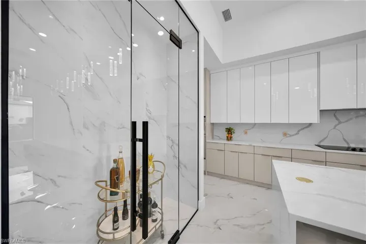 Bathroom featuring tile walls, tile flooring, and backsplash