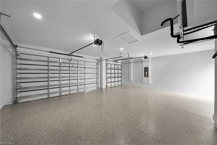 Garage featuring a garage door opener