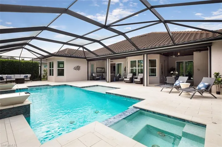 View of swimming pool featuring an outdoor hangout area, ceiling fan, a patio, and a pool with connected hot tub