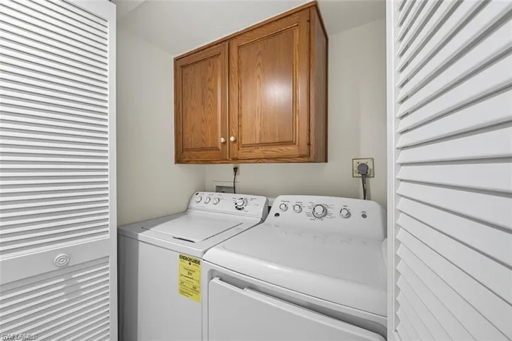 Laundry room featuring cabinet space and washing machine and dryer