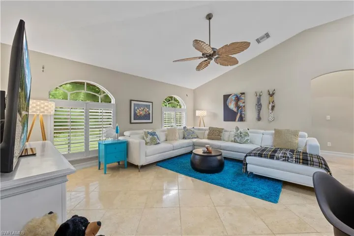 High ceilings and travertine flooring with plenty of space for entertaining.