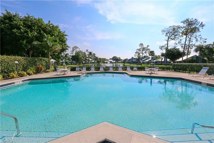 Community pool featuring a deck area.