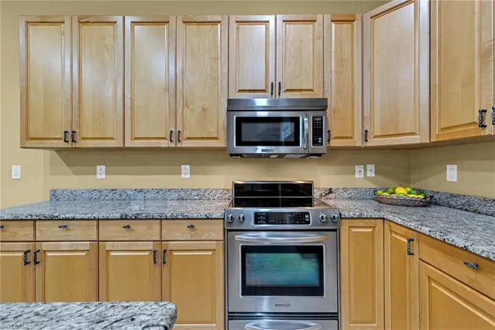 Granite countertops and wood cabinets