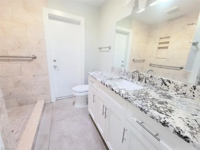 Owner's Bathroom w/White Shaker Cabinets & Granite Counters & Shower