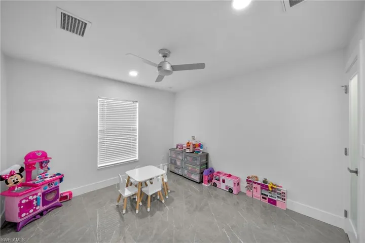 Recreation room with ceiling fan