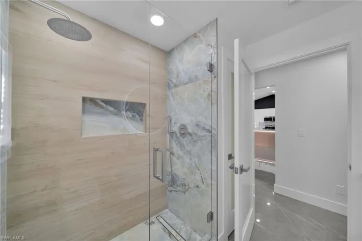Bathroom featuring a shower with shower door