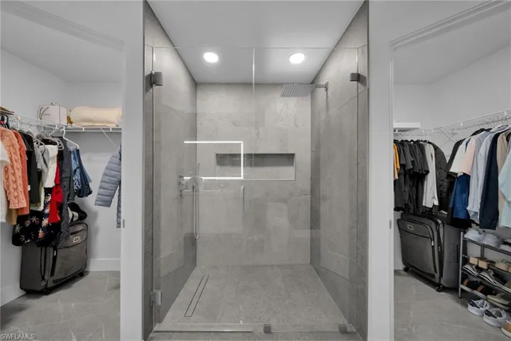 Bathroom featuring a shower with door