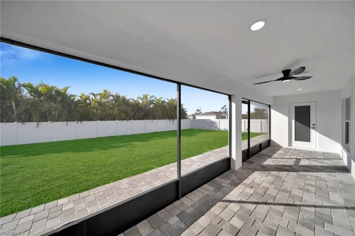 View of patio featuring ceiling fan