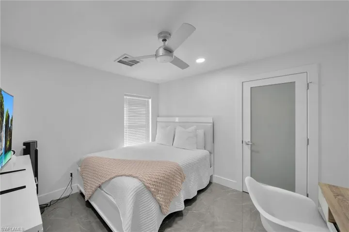 Bedroom featuring ceiling fan
