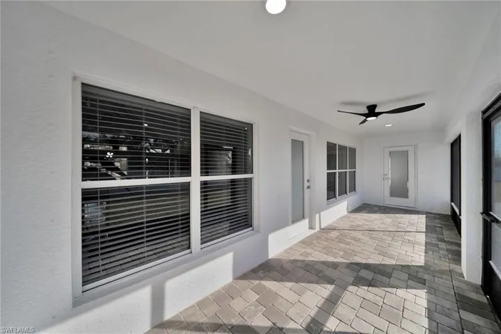 View of patio featuring ceiling fan