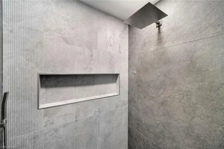 Interior details featuring walk in shower