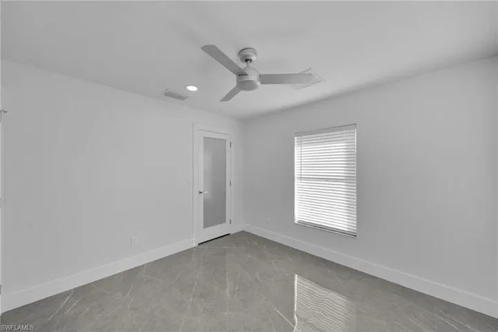 Unfurnished room with ceiling fan