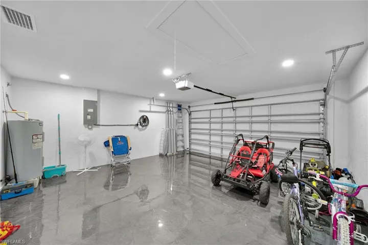 Garage with water heater and electric panel
