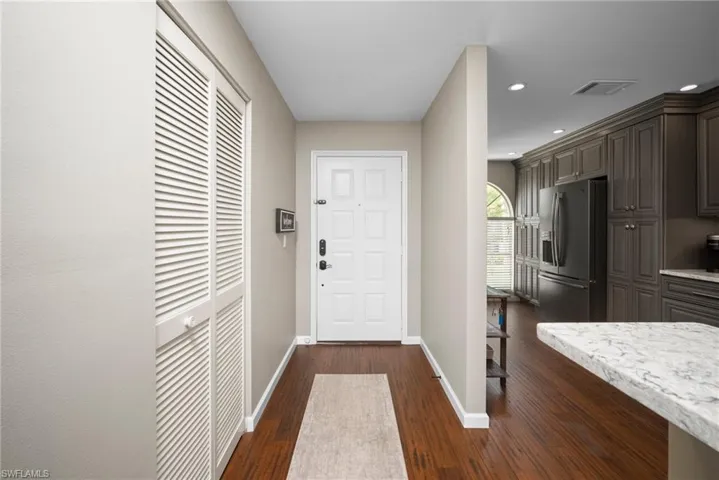 Entryway featuring wood finished floors and recessed lighting