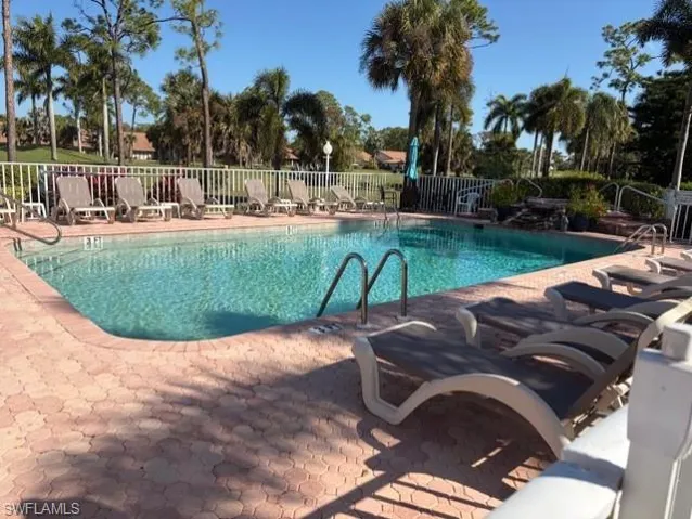 Community pool featuring a patio
