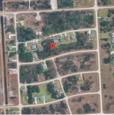 Aerial map of property and surrounding area featuring property parcel outlined