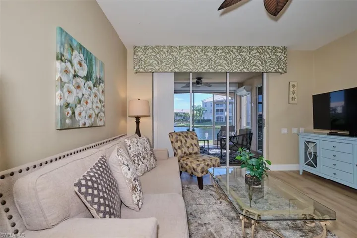Living room featuring ceiling fan and hardwood / wood-style floors
