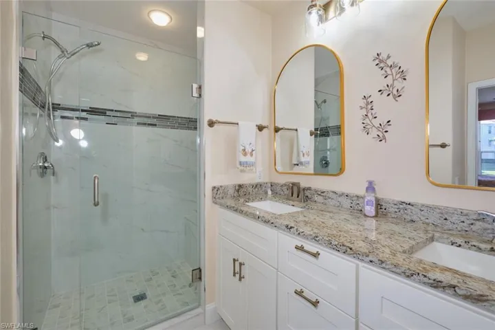 Bathroom with walk in shower and vanity