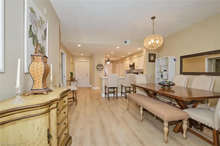 Dining room featuring a chandelier and light hardwood / wood-style flooring