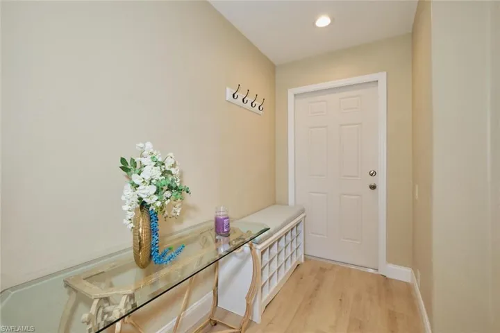 Doorway to outside with light hardwood / wood-style floors