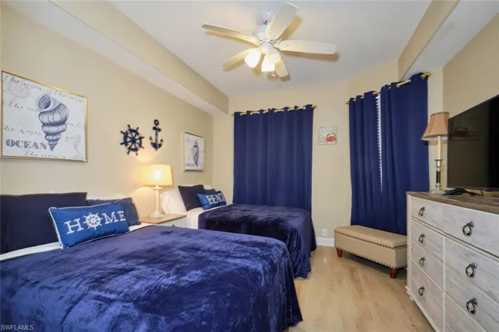 Bedroom featuring light wood-type flooring and ceiling fan