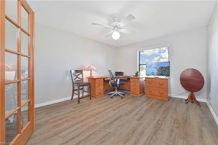 Office featuring ceiling fan and light hardwood / wood-style floors