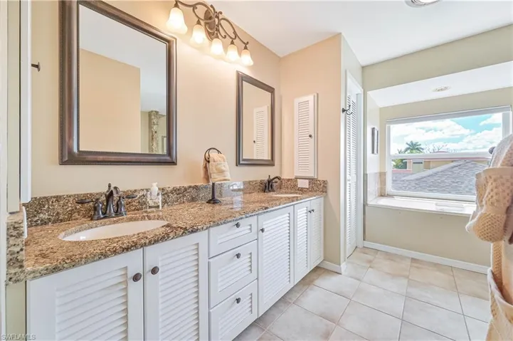 Bathroom with vanity and tile patterned floors