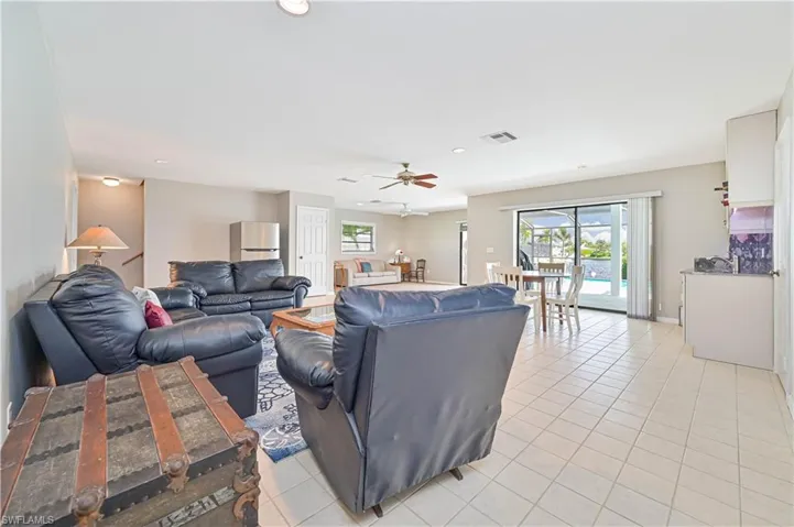 Tiled living room with ceiling fan
